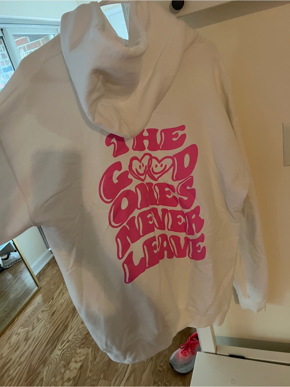 White Hoodie with Pink 'The Good Ones Never Leave' Graphic